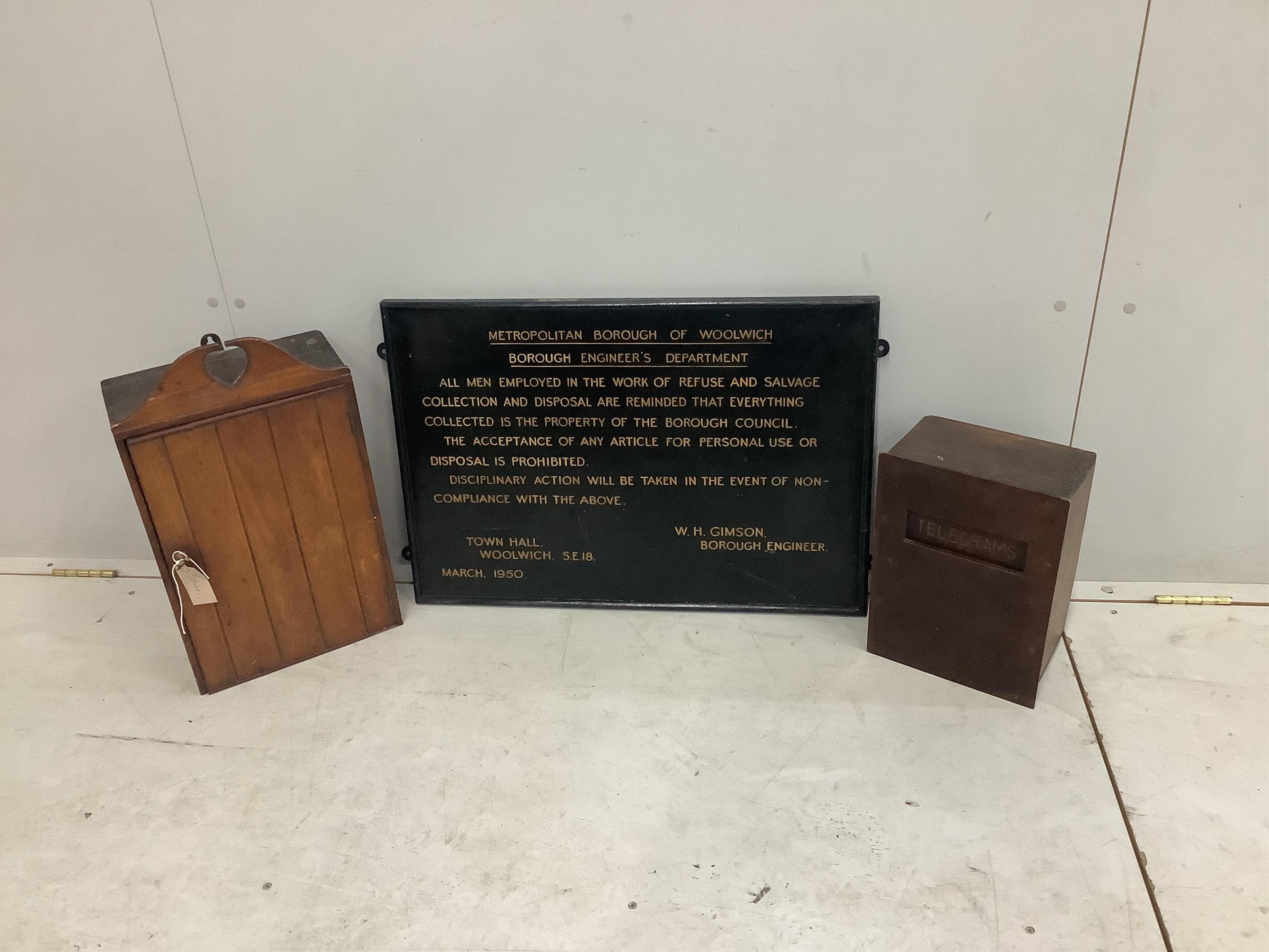 A vintage telegrams box, a small wall cabinet, height 52cm and a Metropolitan Borough of Woolwich engineer's department sign, dated March 1950, 48 x 70cm. Condition - light scuffing to sign, otherwise all fair to good